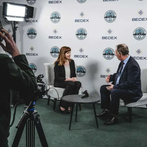 Pascale Delcomminette, CEO of the Wallonia Export & Investment Agency (AWEX), speaks with Alain Servaes, CEO of Army Recognition Group, during an interview at the Army Recognition Group Studio, Official Web TV of BEDEX 2026, discussing AWEX’s strategy to support Walloon companies entering the defense sector and integrating into international military supply chains.