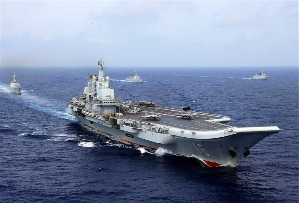 Chinese aircraft carrier Liaoning conducts live-fire combat drills in the Western Pacific as China expands its naval power projection capabilities.