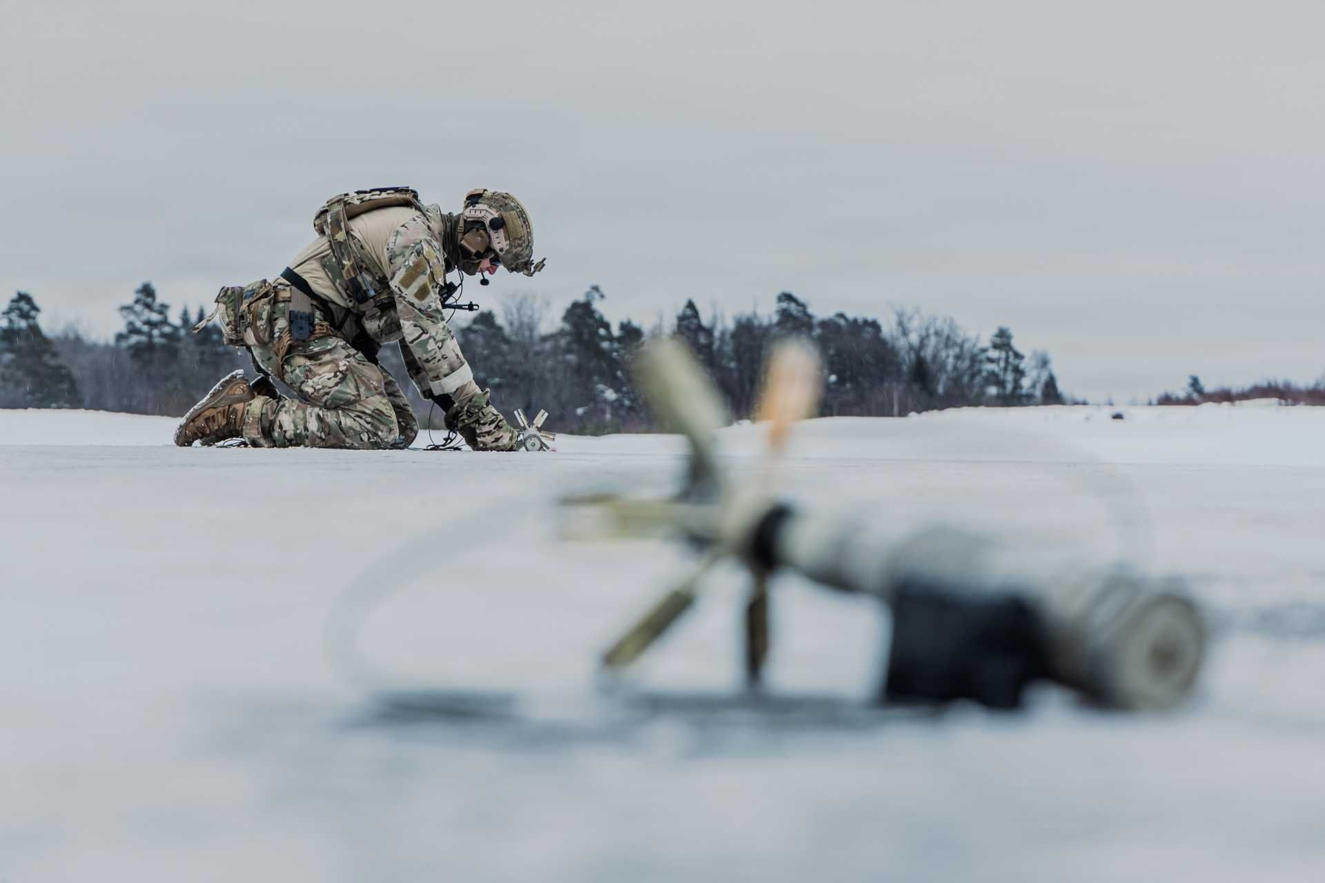U.S. Navy Explosive Ordnance Disposal technicians assigned to Explosive Ordnance Disposal Mobile Unit Eight execute a rapid airfield damage repair scenario during Exercise Arctic Specialist 2026 in Arctic conditions.