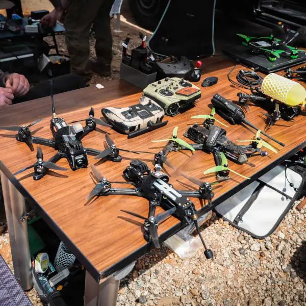 Operators from the U.S. Army's 1st Special Forces Command (Airborne) prepare unmanned aerial vehicle control equipment ahead of a counter-drone demonstration in Ellerbe, North Carolina, on May 5, 2026. The exercise showcased emerging technologies and tactics designed to detect, track, and defeat hostile unmanned aerial threats in operational environments.