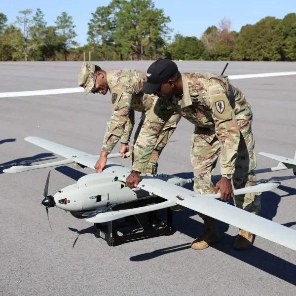 U.S. Army Aviation soldiers Sgt. Joshua Capers and Staff Sgt. Alwyne Smith of the 1st Aviation Brigade adjust the position of a VXE30 Stalker uncrewed aircraft during a training session at Fort Rucker on November 18, 2025.