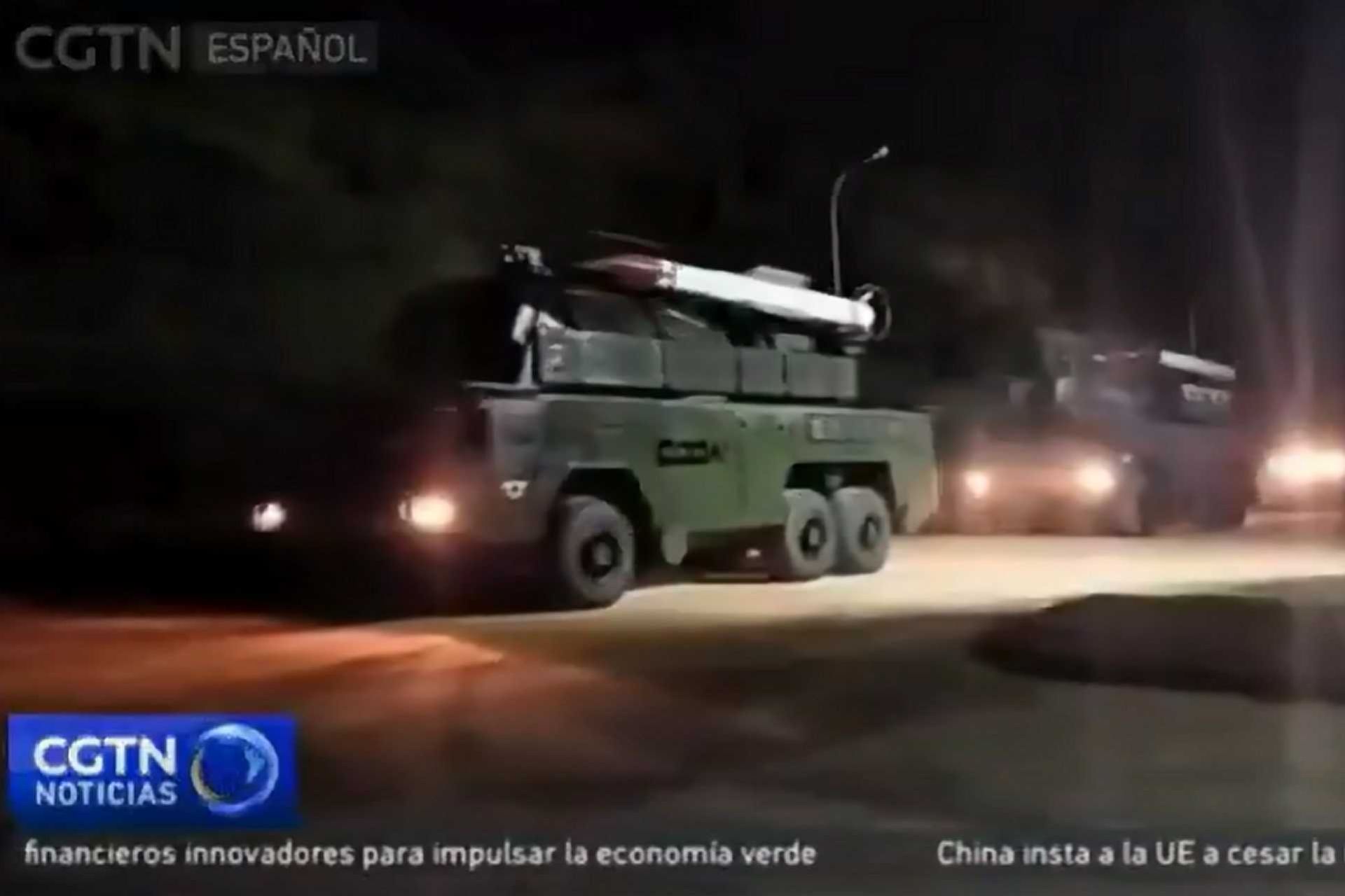 Venezuelan Buk-M2E surface-to-air missile system deployed west of Caracas, Venezuela. Image captured from local media footage showing the movement of launcher vehicles and radar units on October 25, 2025, indicating full combat readiness.