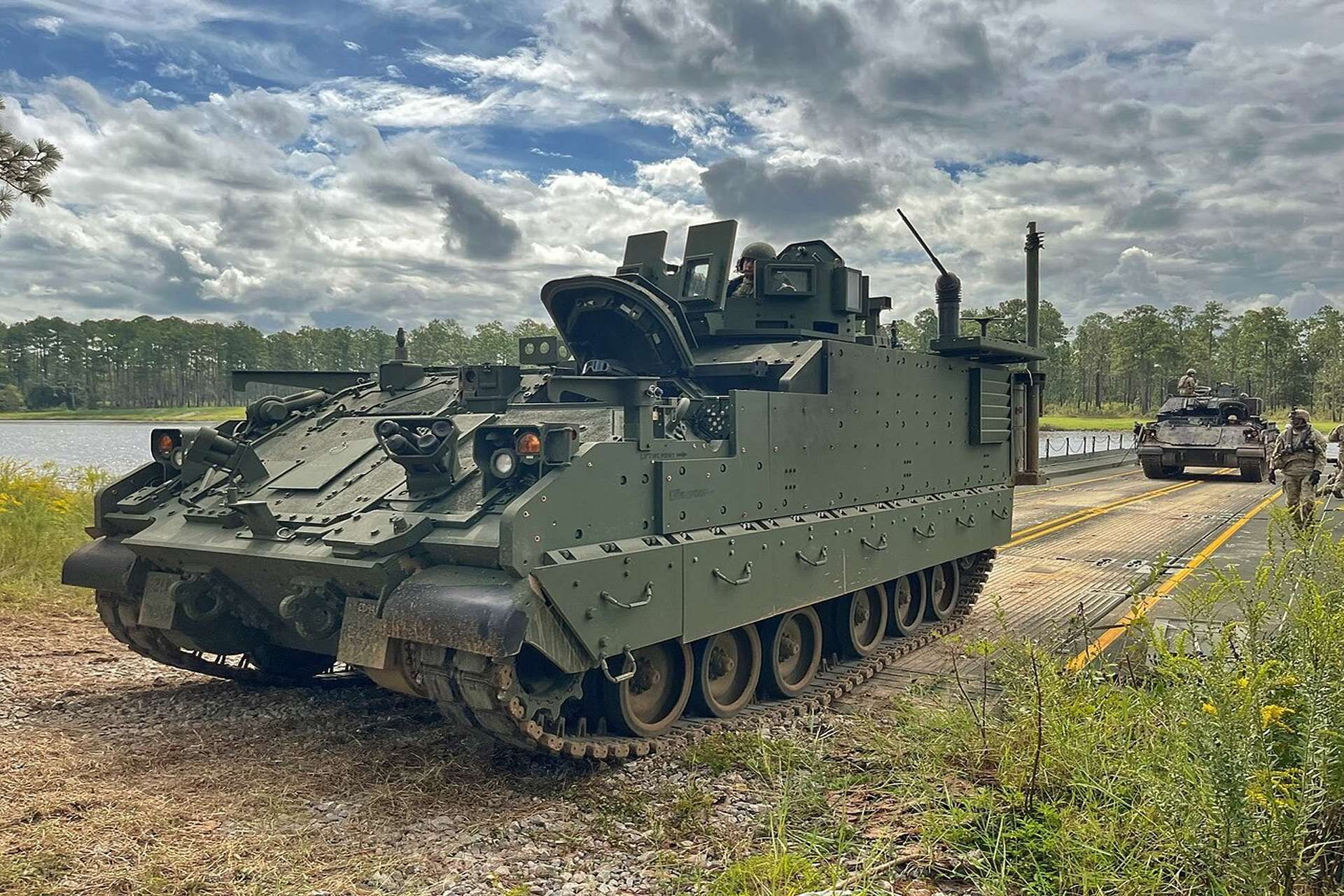 AMPV variants typically carry a protected turret or remote weapon station armed with a 12.7 mm heavy machine gun or Mk 19 40 mm automatic grenade launcher for under-armor suppressive fire and close-in defense, while the M1287 mortar carrier adds a mounted 120 mm mortar with digital fire control to deliver rapid, protected indirect fires in direct support of armored maneuver (Picture source: U.S. DoW).