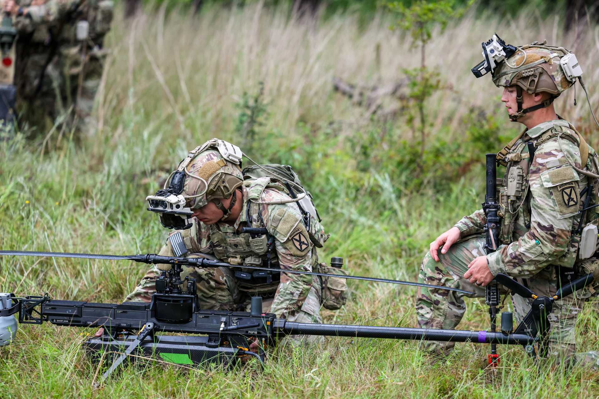 At Camp Beauregard, Louisiana, soldiers from Sioux Company, Multi-Purpose Company, 3rd Brigade, 10th Mountain Division, prepare to launch a Ghost-X Medium-Range Reconnaissance drone while operating the Soldier Borne Mission Command Surrogate system during a field training exercise.