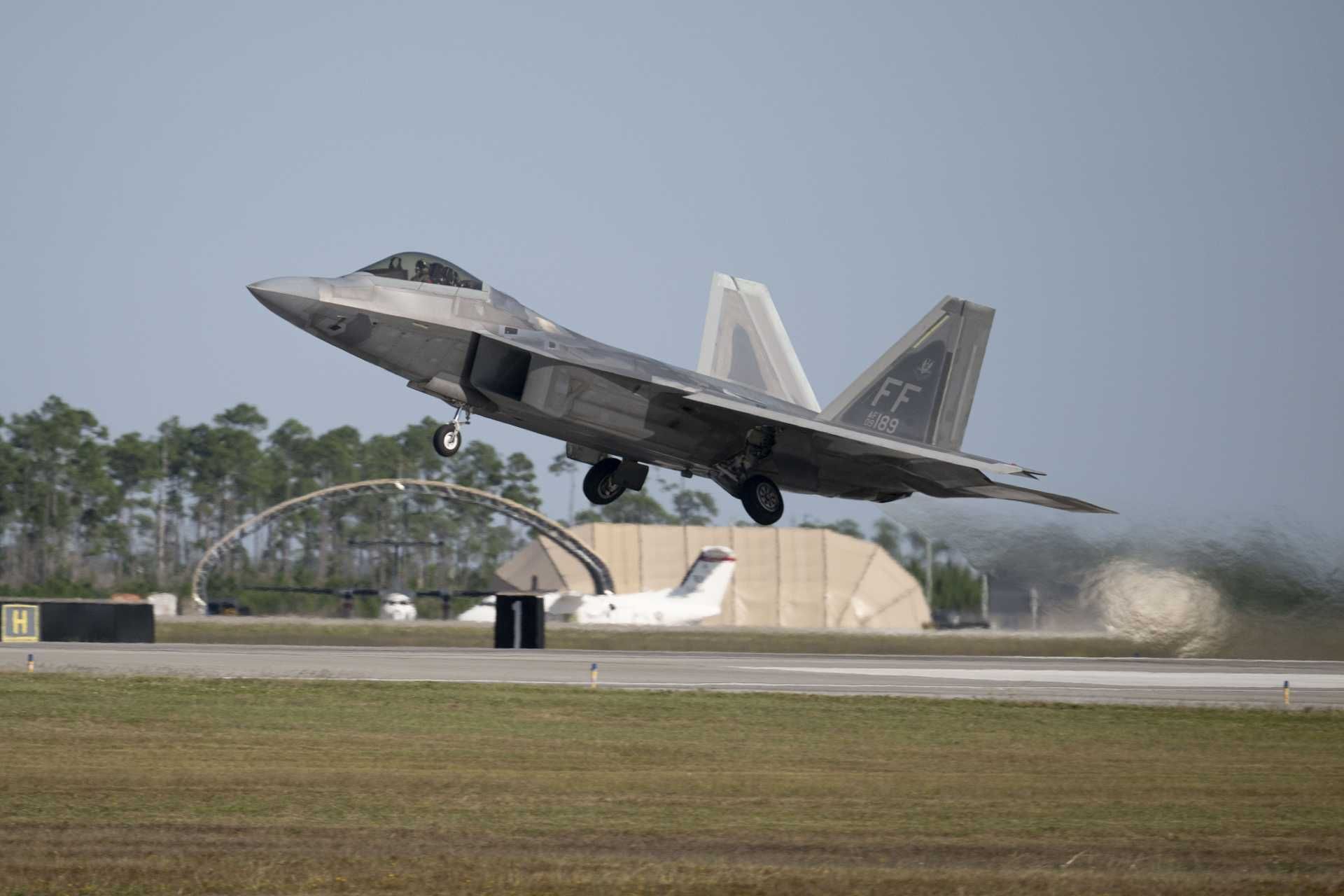 An F-22 Raptor fighter aircraft from the U.S. Air Force 27th Fighter Squadron, Joint Base Langley-Eustis, Virginia, takes off from Tyndall Air Force Base, Florida, during the Checkered Flag 26-1 air combat exercise on October 22, 2025.