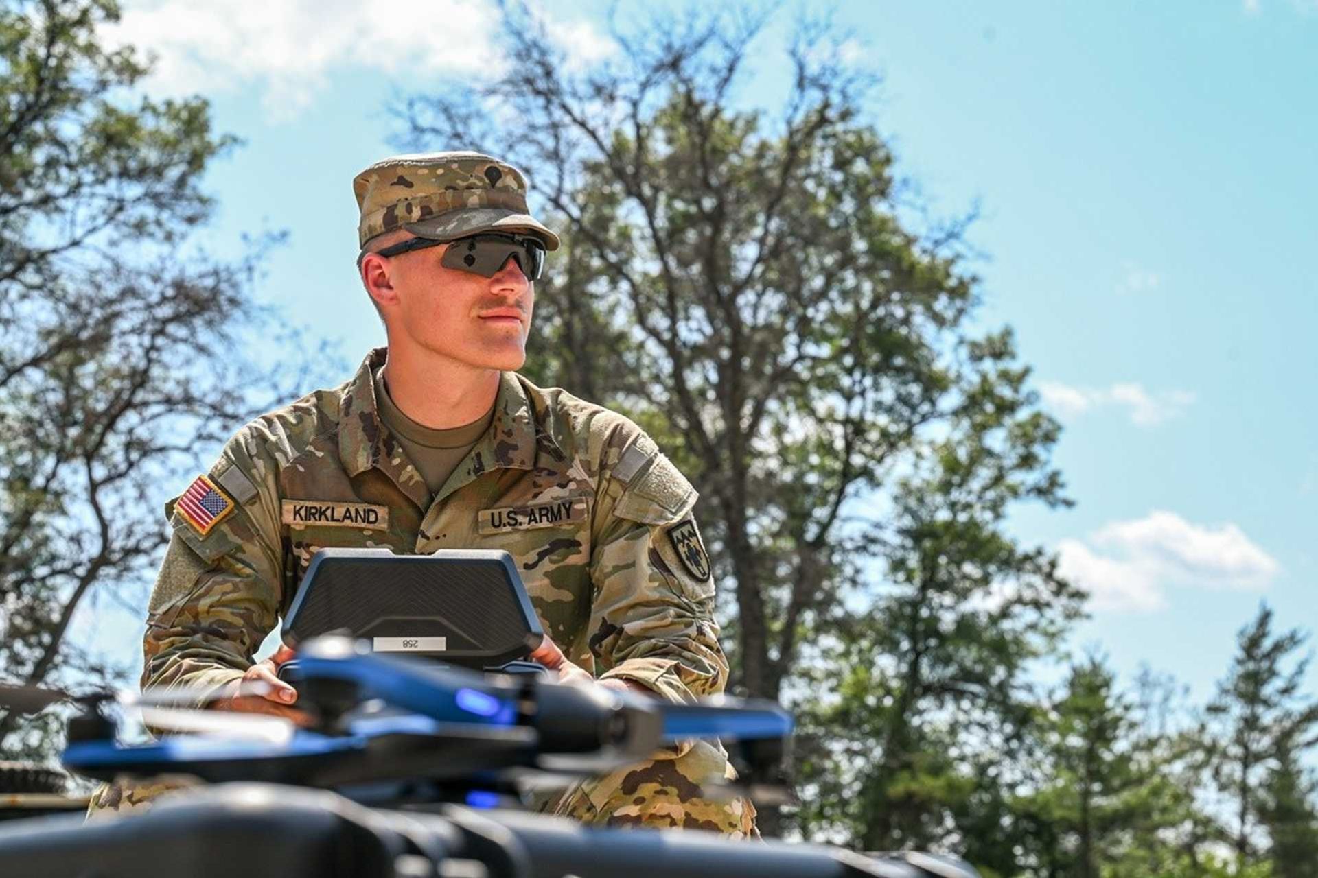 U.S. Army Specialist Elija Kirkland, assigned to 1st Battalion, 119th Field Artillery Regiment, operates an uncrewed aerial system in support of a cannon battery mission during Exercise Northern Strike 24-2 at Camp Grayling Joint Maneuver Training Center, Michigan.