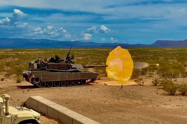 U.S. Army M1A2 Abrams main battle tanks from the 1st Battalion, 67th Armored Regiment, 3rd Armored Brigade Combat Team, conduct live-fire accuracy screening at a desert training range to verify 120mm gun precision, fire-control settings, and crew readiness before qualification (Picture source: U.S. DoW).