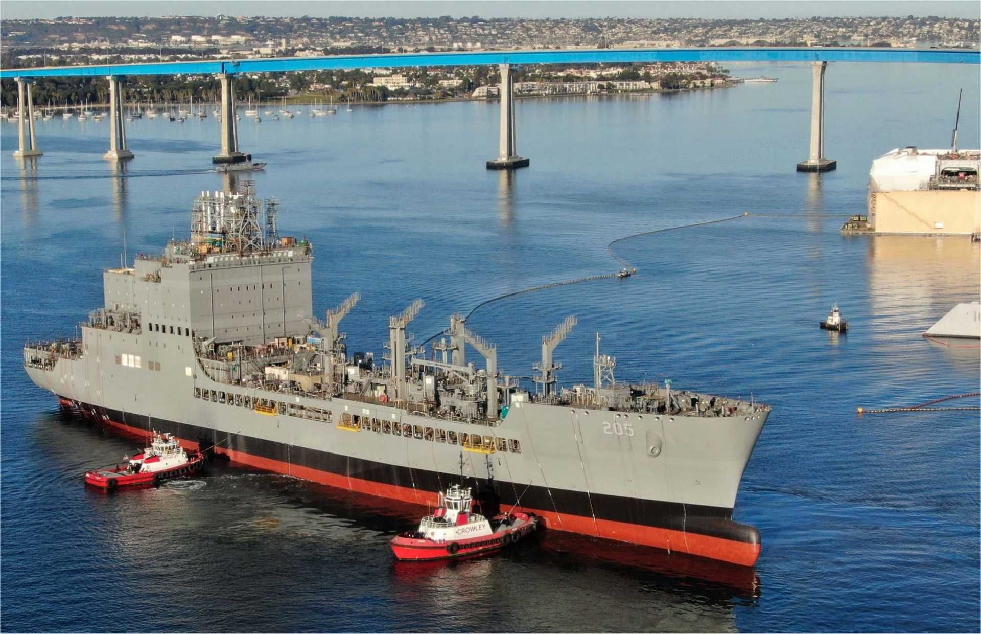 A U.S. Navy John Lewis-class fleet replenishment oiler conducts operations at sea. The future T-AO 217 will provide fuel, dry cargo, and aviation support to deployed naval forces, extending the endurance and operational reach of U.S. warships during sustained maritime operations.