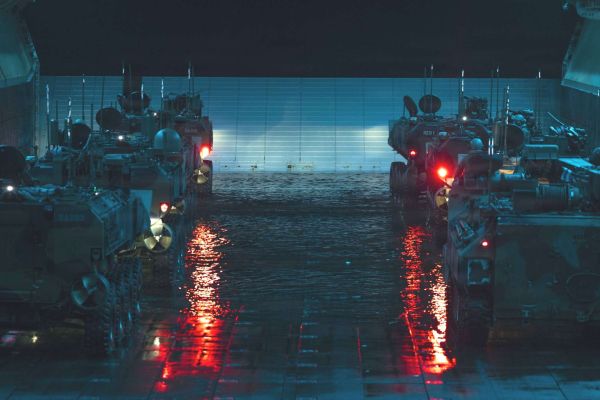 USMC Amphibious Combat Vehicle-Personnel (ACV-P) 8x8: armored, fully amphibious troop carrier launching from assault ships. Carries 3 crew + 13 Marines, swims in open-water surf, then continues high-speed cross-country. Remote weapon station (.50 cal or 40 mm Mk19) provides protected suppressive fire for ship-to-shore assault and inland security (Picture source: U.S. Marines).