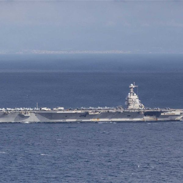 USS Gerald R. Ford (CVN 78), the U.S. Navy’s largest and most advanced aircraft carrier, sails through the Strait of Gibraltar on November 4, 2025, as part of its scheduled deployment with Carrier Strike Group 12.