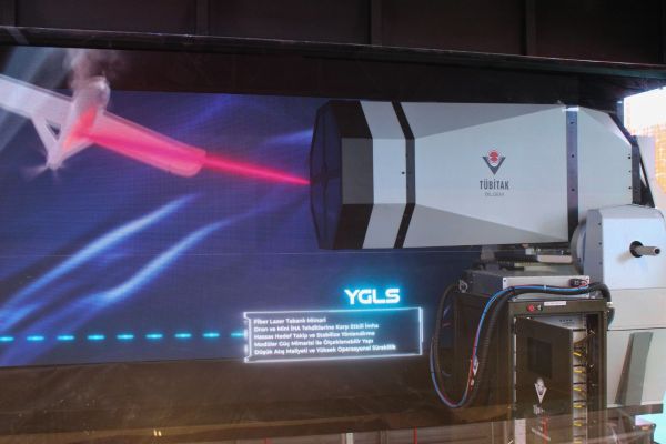 YGLS high-power laser system displayed at SAHA 2026 in Istanbul, developed by TÜBİTAK, featuring a stabilized beam director and modular architecture designed for counter-UAS missions with scalable output up to 80 kW.(Picture source: Army Recognition)
