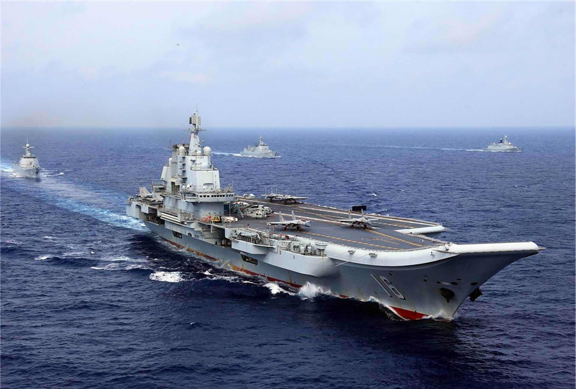 Chinese aircraft carrier Liaoning conducts live-fire combat drills in the Western Pacific as China expands its naval power projection capabilities.