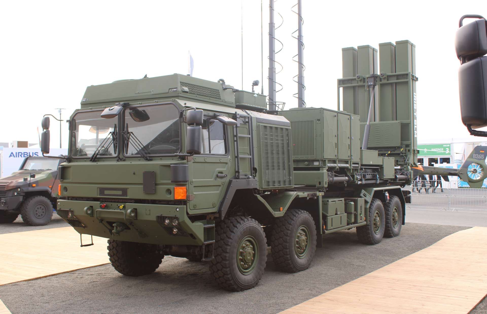 The IRIS-T SLM is a modern medium-range air defense system combining a TRML-4D AESA radar with highly agile infrared-guided missiles, capable of detecting up to 1,500 targets and intercepting aircraft, cruise missiles, and drones at ranges of around 40 km with full 360-degree coverage and high resistance to electronic countermeasures (Picture source: Army Recognition Group).
