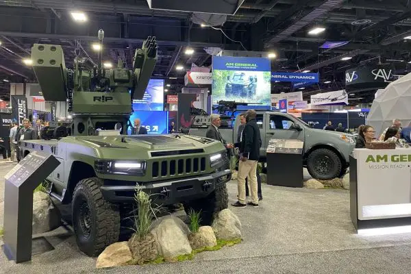 AM General’s combat-ready UGV displayed at Modern Day Marine integrates a Moog RIwP remote turret with 30 mm gun and missile options, giving Marines an autonomous vehicle for resupply, reconnaissance, counter-drone defense, and high-risk missions in contested environments (Picture source: AM General).