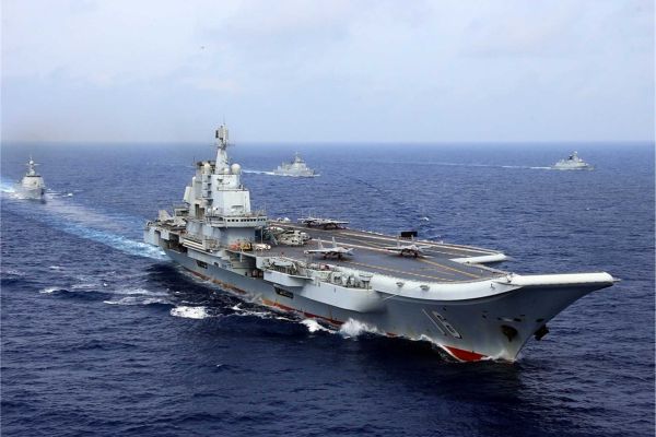 Chinese aircraft carrier Liaoning conducts live-fire combat drills in the Western Pacific as China expands its naval power projection capabilities.