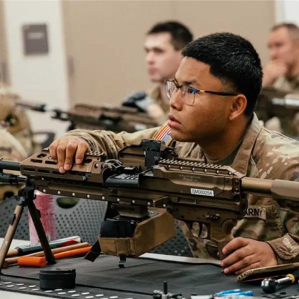 U.S. Soldiers from the U.S. Army’s 34th Infantry Division receive hands-on training with the new M250 automatic rifle during a New Equipment Training session at Camp Ripley, Minnesota, on September 15, 2025.