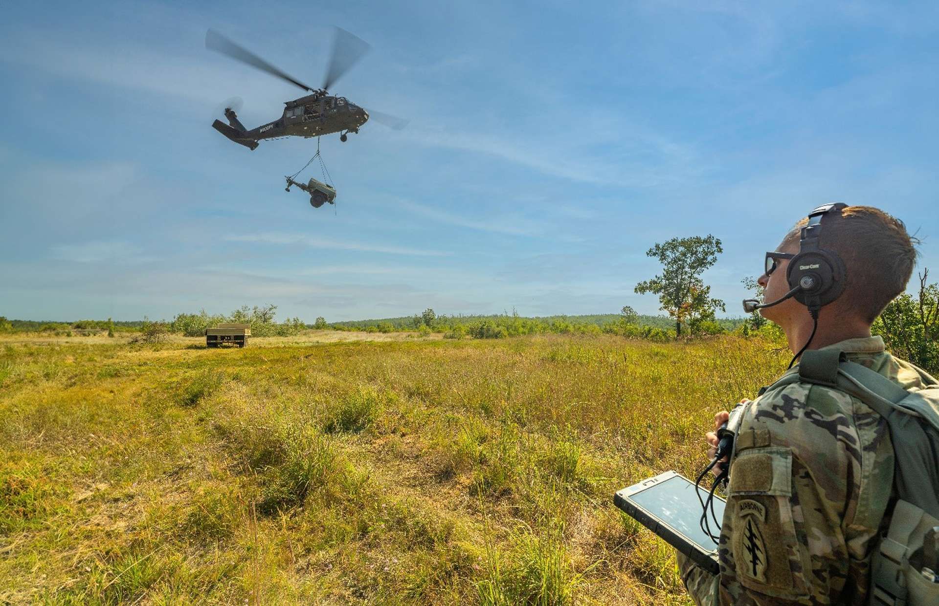 A U.S. Army soldier remotely pilots an autonomous Black Hawk using Sikorsky’s MATRIX system during Northern Strike 25-2, completing resupply, sling load, and MEDEVAC missions from a tablet (Picture source: Lockheed Martin).