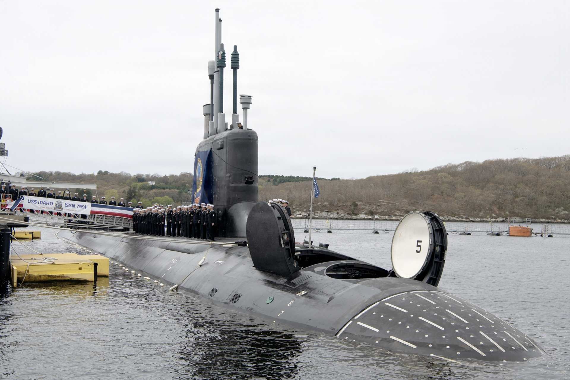 U.S. Navy sailors assigned to the Virginia-class fast attack submarine USS Idaho (SSN 799) stand at attention along the deck during the vessel’s commissioning ceremony at Naval Submarine Base New London in Groton, Connecticut, on April 25, 2026.