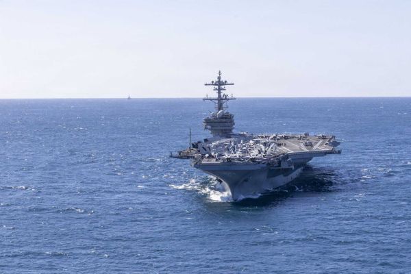 The USS George H.W. Bush is a Nimitz-class aircraft carrier commissioned in 2009, with a displacement of approximately 102,000 tons, a length of 333 meters, and a propulsion system based on two nuclear reactors generating sufficient power for speeds exceeding 30 knots. (Picture source: US Navy)