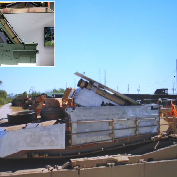 PERCH launcher module mounted on the side of a U.S. Army M1A2 Abrams SEPv3 tank, enabling deployment of Switchblade loitering munitions for beyond-line-of-sight reconnaissance and precision strike capabilities.