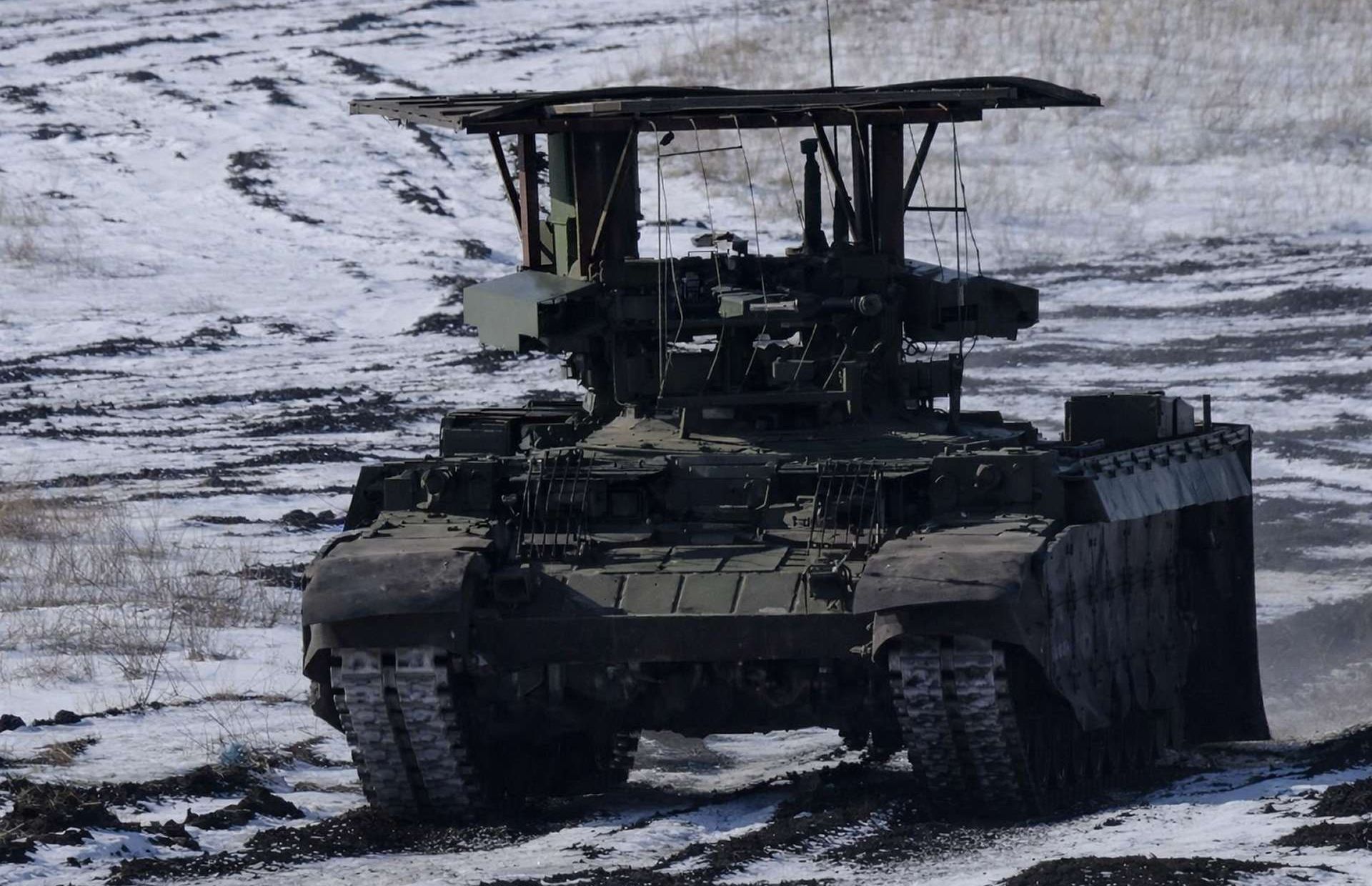 Russia’s BMPT “Terminator” is a heavily armored tank-support vehicle combining twin 30 mm 2A42 autocannons, automatic grenade launchers, and anti-tank guided missiles to rapidly suppress infantry, firing points, and light armor, helping tank units survive and advance in close terrain and urban combat (Picture source: TASS).
