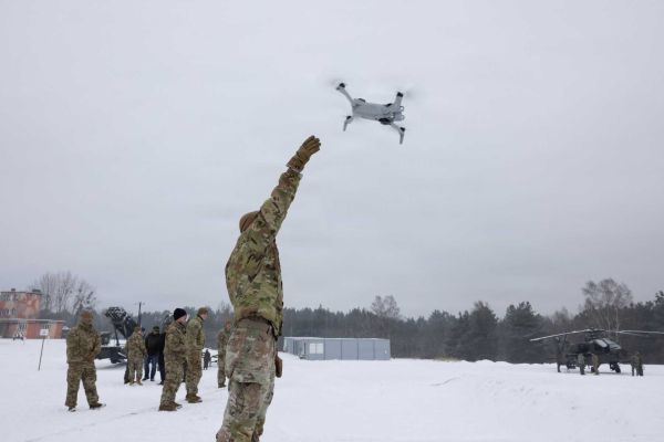 A U.S. Army soldier from the 3rd Squadron, 2nd Cavalry Regiment launches a drone during Operation Winter Falcon 26 at the Drawsko Combat Training Center in Oleszno, Poland, on January 13, 2026. The live drone deployment showcased how unmanned aerial systems are reshaping joint defensive tactics and battlefield awareness for future NATO operations along the alliance's eastern flank.
