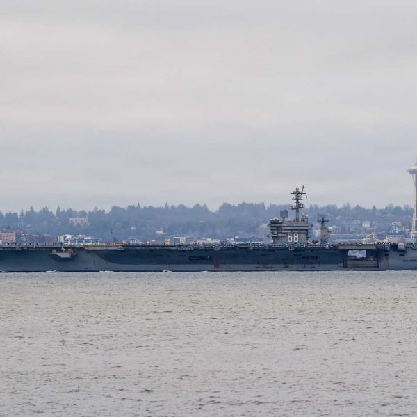 The U.S. Navy Nimitz-class aircraft carrier USS Nimitz (CVN 68) transits Puget Sound during its final departure from Naval Base Kitsap-Bremerton, Washington, March 7, 2026, as the ship prepares for its final operational phase before planned inactivation.