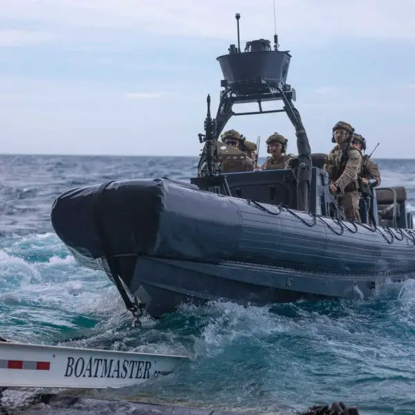 U.S. Marines from the 22nd Marine Expeditionary Unit deploy a rigid-hull inflatable boat from the well deck of the amphibious transport dock USS San Antonio (LPD 17) to conduct a visit, board, search, and seizure mission.