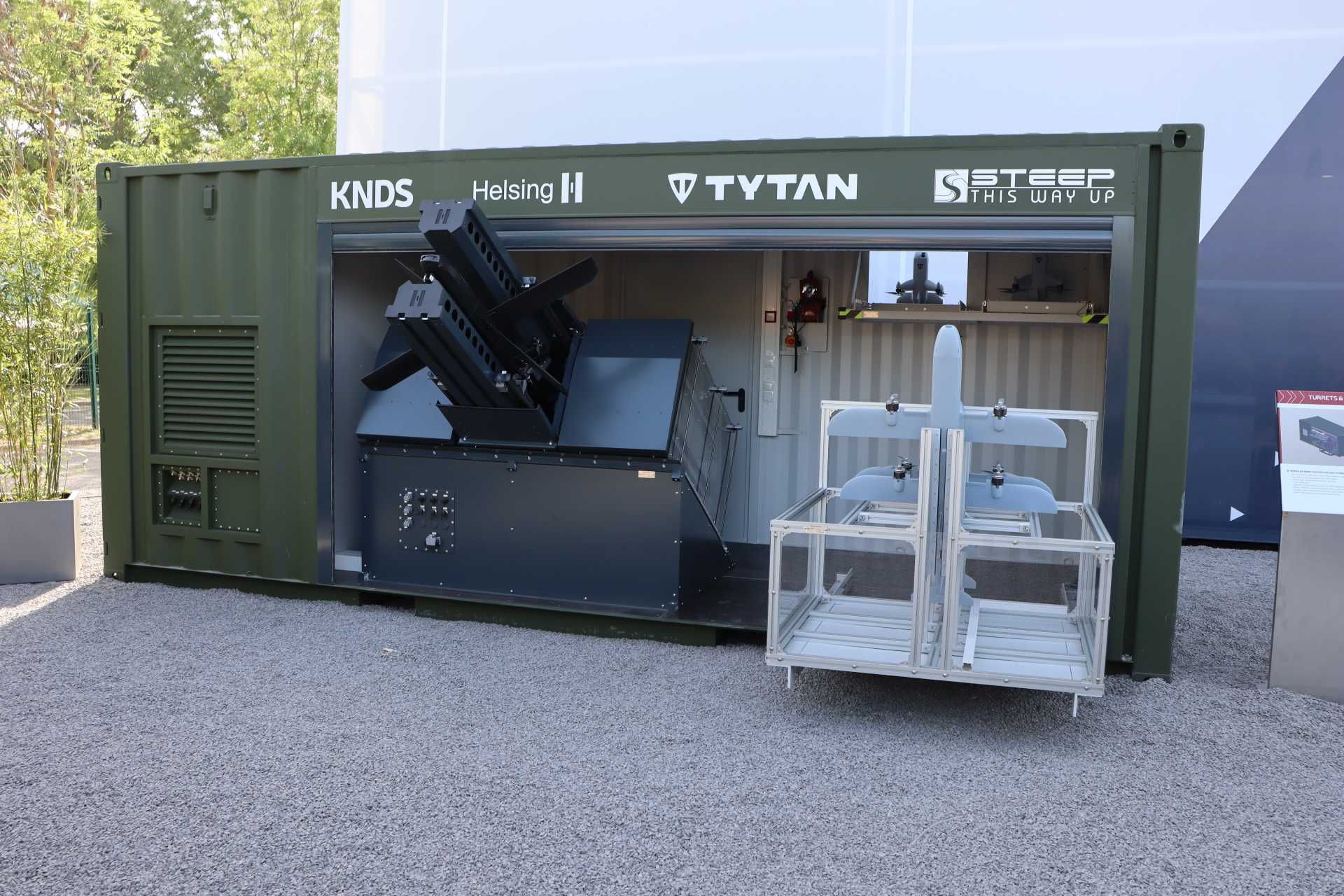 The mock-up demonstrator of KNDS integrated both Helsing HX-2 loitering strike drones and Tytan TI-1 METIS interceptor drones to combine offensive and local air defense functions within a single launch container. (Picture source: Army Recognition)