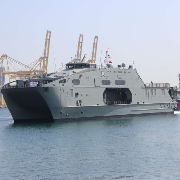 RNOV Al Mubashir (S11) is a 72.5 m high-speed catamaran support ship built to move troops, vehicles, and supplies fast, with a large RO-RO deck, helicopter-capable flight deck, shallow-draft access, and defensive guns for regional security and relief missions (Picture source: Army Recognition Group).