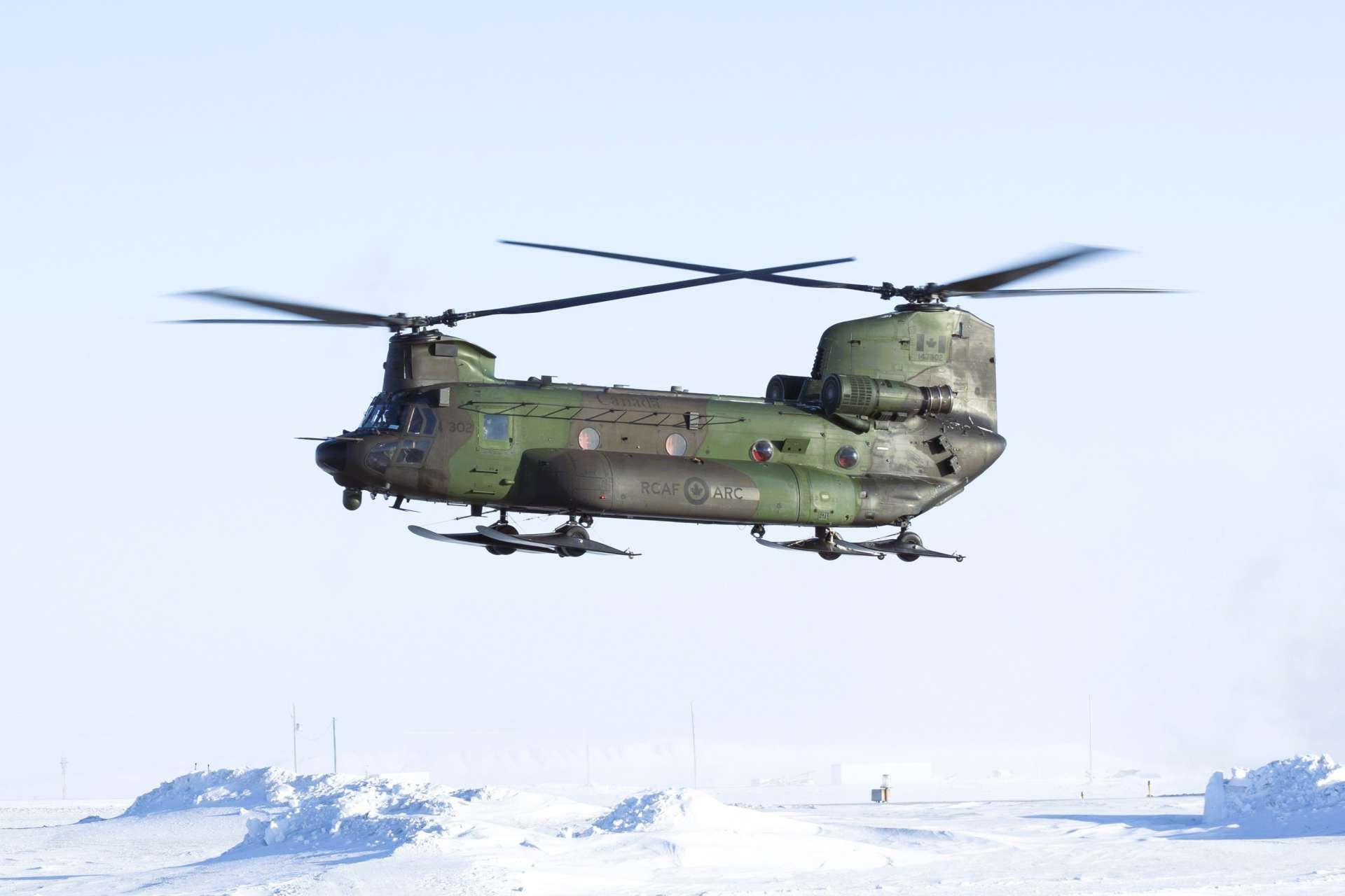 Canada is using CH-147F Chinook helicopters to project forces across its Arctic territory during Operation NANOOK-NUNALIVUT 2026, while the U.S. Army simultaneously trains AH-64E Apache crews for deep-attack missions in Alaska, highlighting a growing North American focus on cold-weather combat aviation (Picture Source:  Canadian Armed Forces Combat Camera)