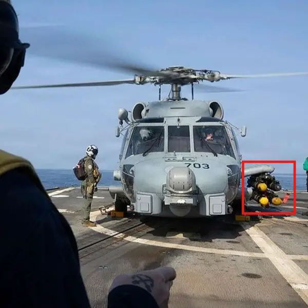 A U.S. Navy MH-60R Seahawk armed with Hellfire missiles was photographed operating from the destroyer USS Delbert D. Black during Operation Epic Fury, highlighting the Navy’s expanded airborne strike capability against small maritime threats in the CENTCOM region (Picture Source: U.S. Navy)