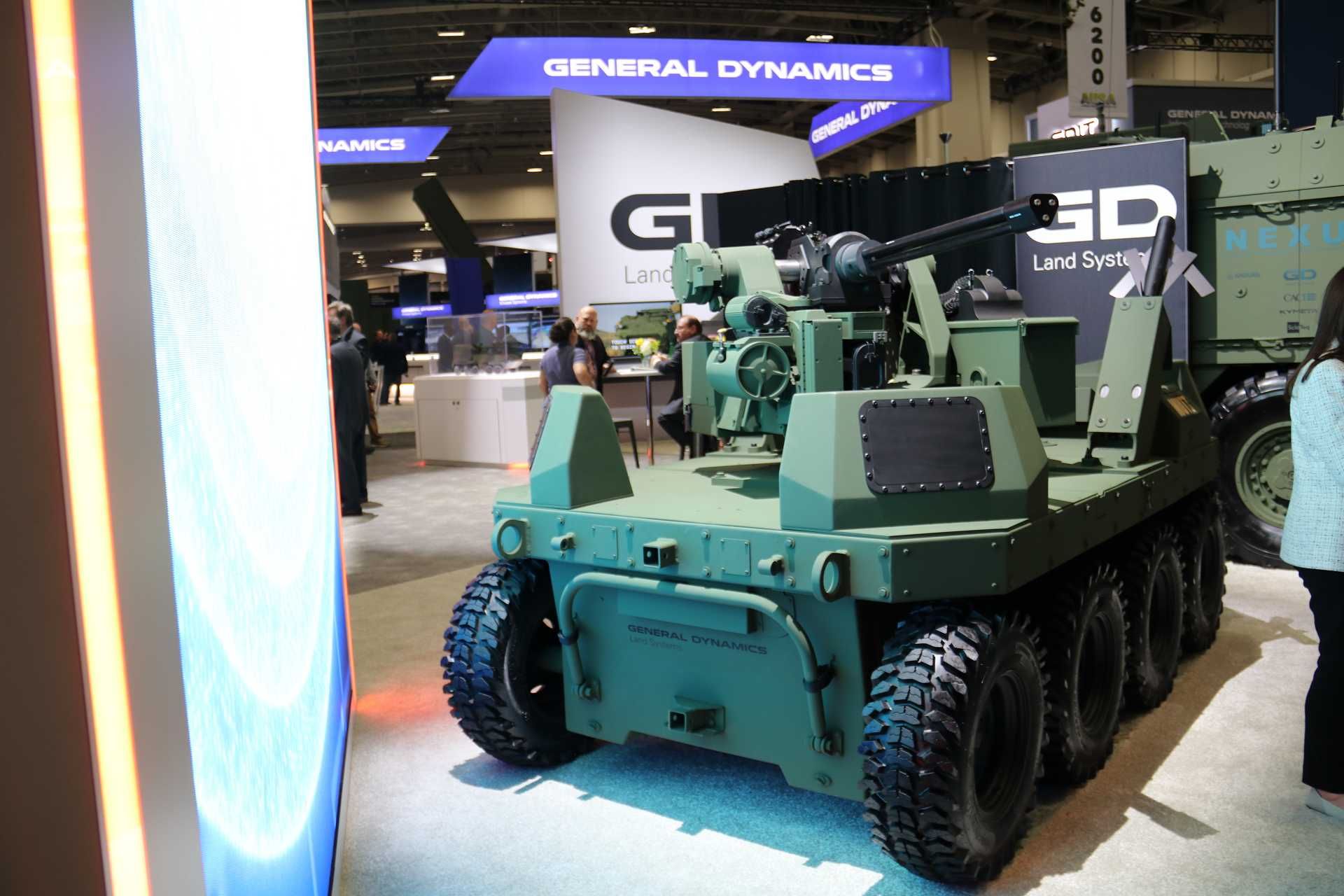 The new General Dynamics MUTT XM robotic vehicle showcased at AUSA 2025 features a Kongsberg RS6 weapon station armed with an XM915 20mm Gatling gun, highlighting its counter-UAS capability and advanced autonomous mobility for future U.S. Army missions.