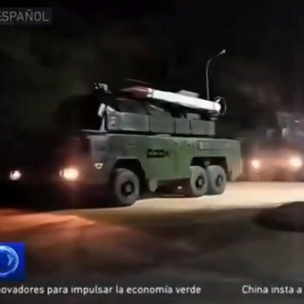 Venezuelan Buk-M2E surface-to-air defense missile system deployed west of Caracas, Venezuela. Image captured from local media footage showing the movement of launcher vehicles and radar units on October 25, 2025, indicating full combat readiness.
