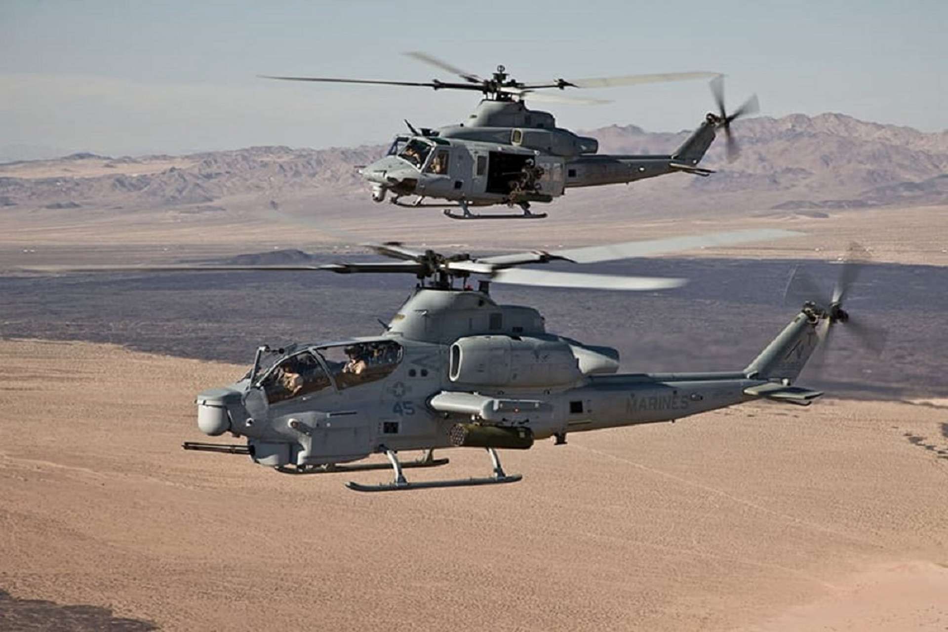 AH-1Z Viper and UH-1Y Venom helicopters fly in formation, showcasing their versatility and combat readiness (U.S. Marine Corps)