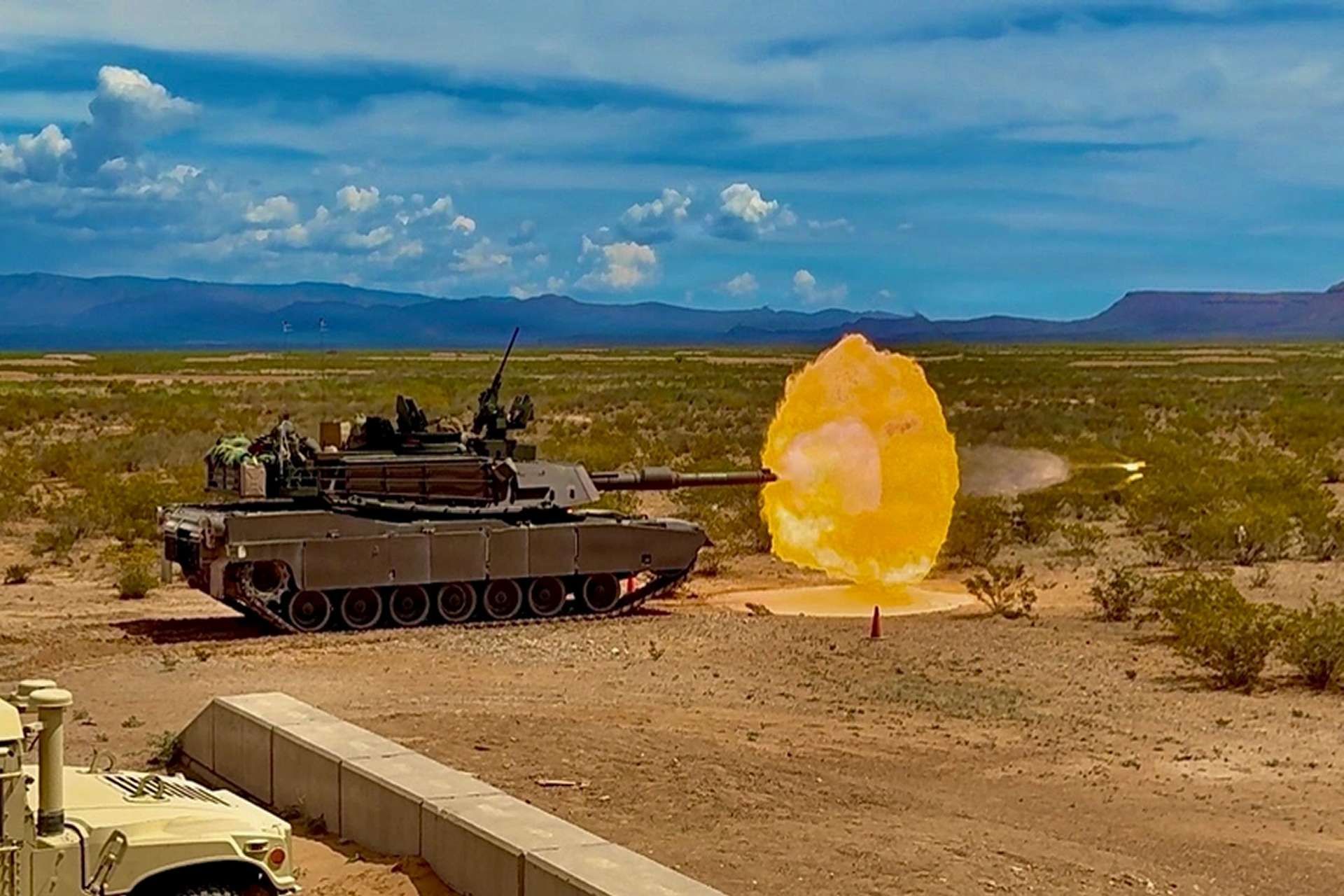 U.S. Army M1A2 Abrams main battle tanks from the 1st Battalion, 67th Armored Regiment, 3rd Armored Brigade Combat Team, conduct live-fire accuracy screening at a desert training range to verify 120mm gun precision, fire-control settings, and crew readiness before qualification (Picture source: U.S. DoW).
