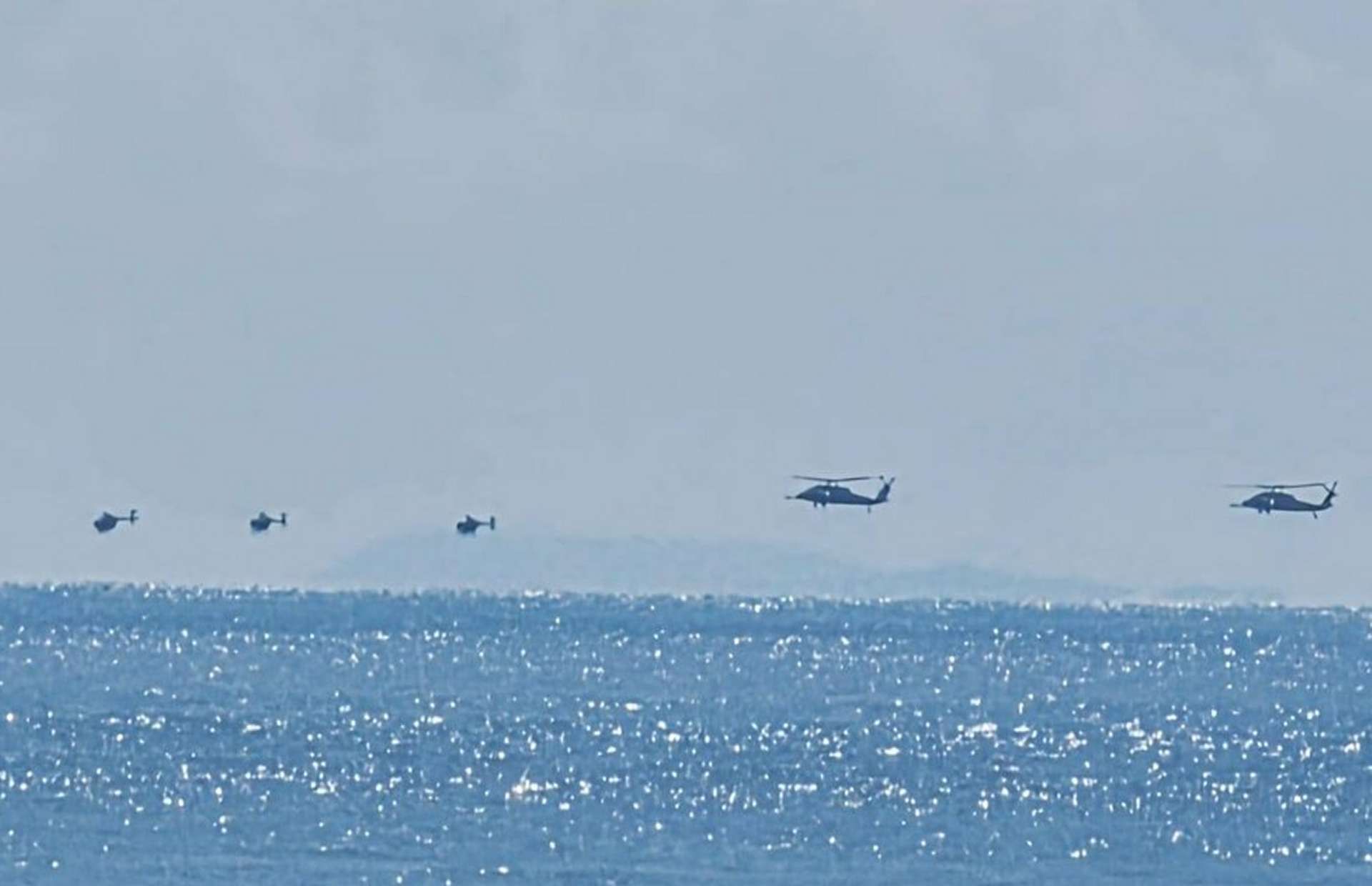 Night Stalker MH-60s and MH-6s operate near Venezuela with a B-52 overhead and MV Ocean Trader at sea, boosting counter-narcotics reach and rapid raid options (Picture source: Abby Karim on social media).