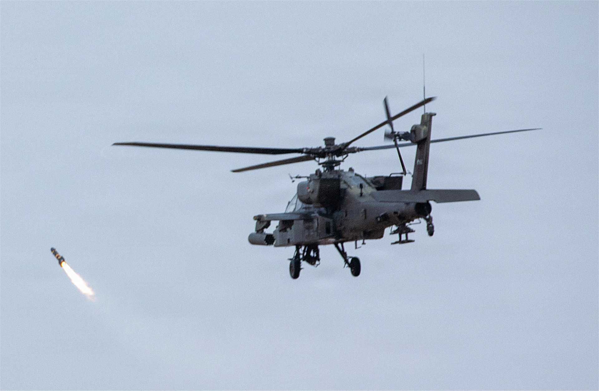 A U.S. Army AH-64 Apache operates during a live-fire phase of Exercise Sky Shield at the Udari Range Complex in Kuwait on Dec. 9, 2025.