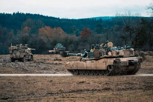 An M1A2 Abrams main battle tank maneuvers during NATO’s Combined Resolve 26-05 at Hohenfels, Germany, where U.S. armored forces and allies rehearse high-intensity combined arms operations to prove rapid reinforcement, interoperability, and credible deterrence on Europe’s eastern flank (Picture source: U.S. DoW).