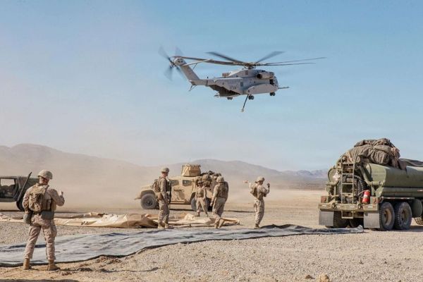 A U.S. Marine Corps CH-53K King Stallion from HMH-461 lifts off at Twentynine Palms during SLTE 1-26 as MWSS-272 establishes a forward arming and refueling point, rehearsing rapid, low-signature sustainment and heavy-lift support in a simulated contested environment (Picture source: U.S. DoW).