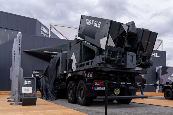 The new IRIS-T SLS Mk 4 short-range air defense system displayed by Diehl Defence at ILA 2026 in Berlin. The highly mobile all-in-one system integrates radar, command-and-control functions, and an eight-missile launcher on a single vehicle, providing rapid-response protection against aircraft, helicopters, cruise missiles, drones, and loitering munitions.