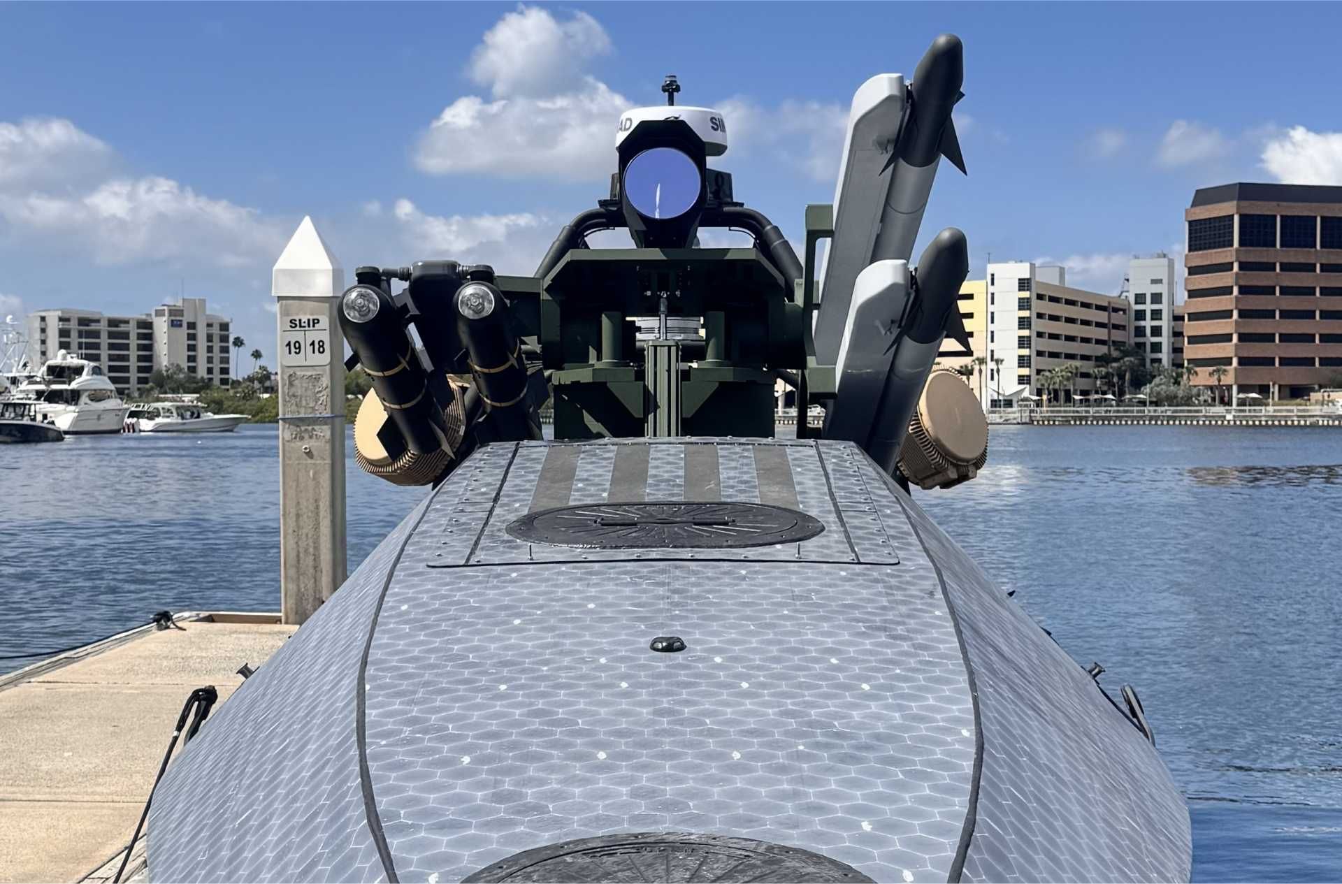 BlackSea Technologies’ Comet unmanned surface vessel displayed at SOF Week 2026 in Tampa, Florida. The 13.1-meter (43-foot) autonomous combat vessel can be armed with precision-guided missiles and a 30mm remotely operated gun system while supporting counter-UAS, surface warfare, and maritime escort missions in contested environments.