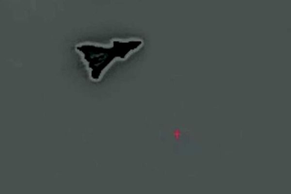 The mysterious aircraft's compact, triangular shape with cranked-kite wings, a sharp nose, possible canards, a sawtooth trailing edge, and no visible vertical tails strongly and strikingly match what is expected of the secretive F-47 fighter. (Picture source: YouTube/Project Fear via X/@OSPSF)