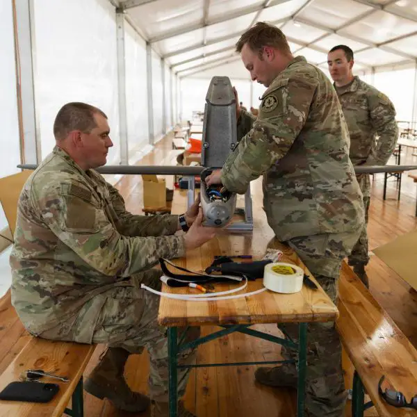 U.S. Army Staff Sgt. Nicholas Davis and Staff Sgt. Terrence Giles of the Field Artillery Squadron, 2d Cavalry Regiment, assemble a Hornet one-way attack drone during training and tactical integration exercises at the Bemowo Piskie Training Area in Poland as part of NATO’s Eastern Flank Deterrence Initiative running from April 27 to May 31, 2026.