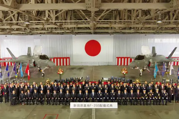 Japanese defense officials and Japan Air Self-Defense Force personnel attend the F-35B deployment commemoration ceremony at Nyutabaru Air Base on February 7, marking the official entry of the STOVL stealth fighter into frontline service.