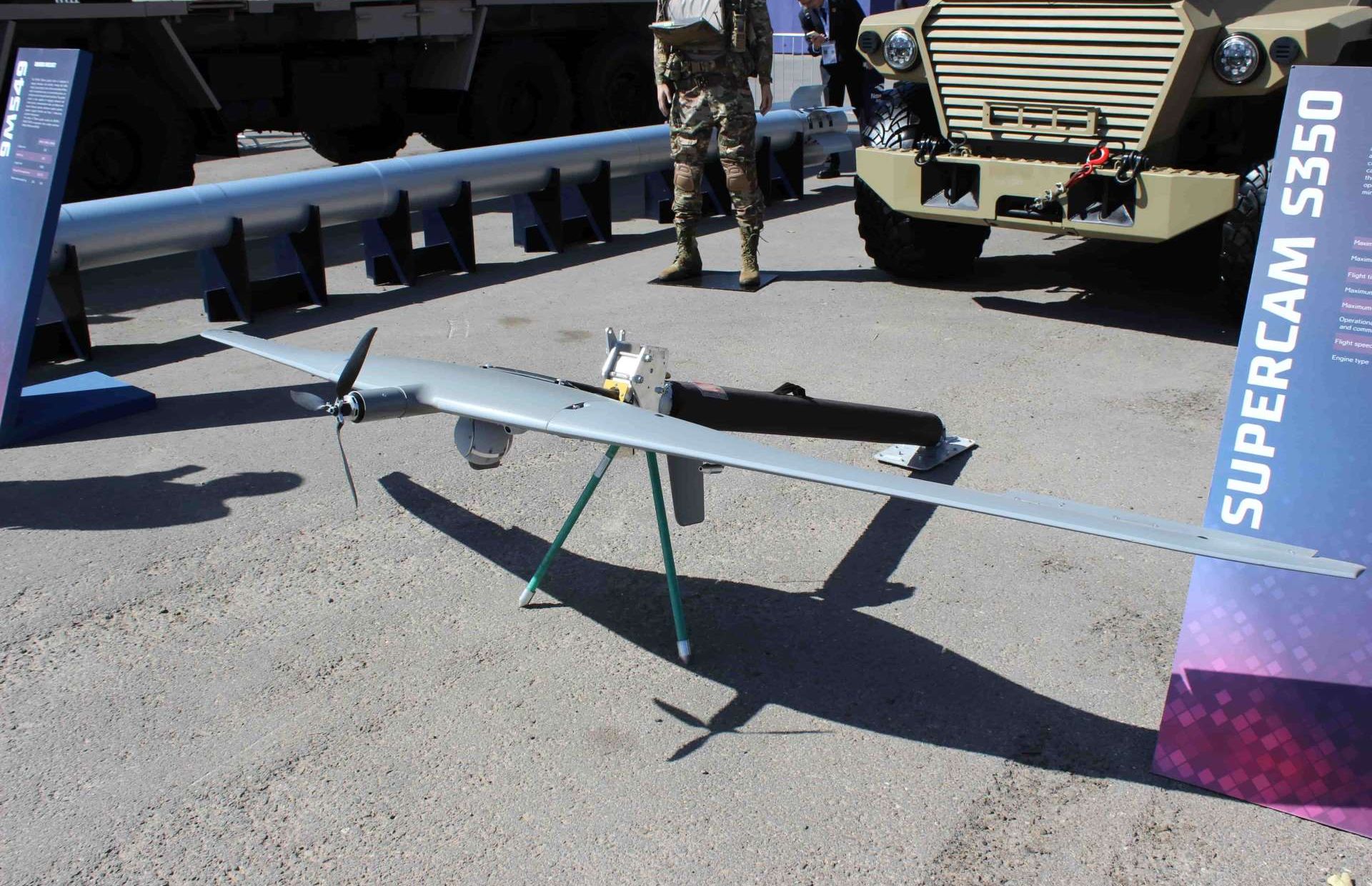 Supercam S350 tactical UAV at WDS Riyadh, a 15 kg class electric flying-wing drone carrying EO/IR sensors (40x day zoom, thermal night camera) for rapid deploy reconnaissance, with up to 5.5 hours endurance, over 240 km flight range, 100 km control link, and parachute recovery for austere operations (Picture source: Army Recognition Group).