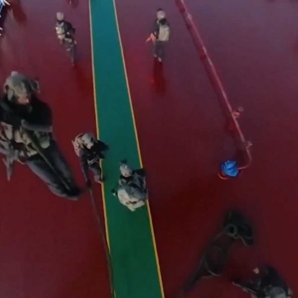 French Commandos Marine fast‑rope from a French Navy helicopter during a maritime boarding operation against a Russian‑linked oil tanker in the Mediterranean Sea, illustrating France’s naval special forces capability to conduct high‑risk interdiction missions at sea.