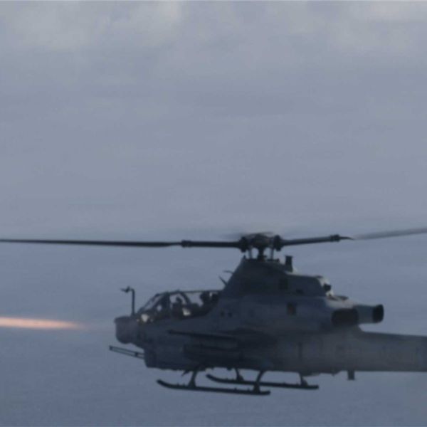 A U.S. Marine Corps AH-1Z Viper attack helicopter assigned to the 22nd Marine Expeditionary Unit conducts a live-fire launch of an AIM-9 Sidewinder missile during a training exercise over the Caribbean Sea on November 25, 2025, as part of Operation Southern Spear.