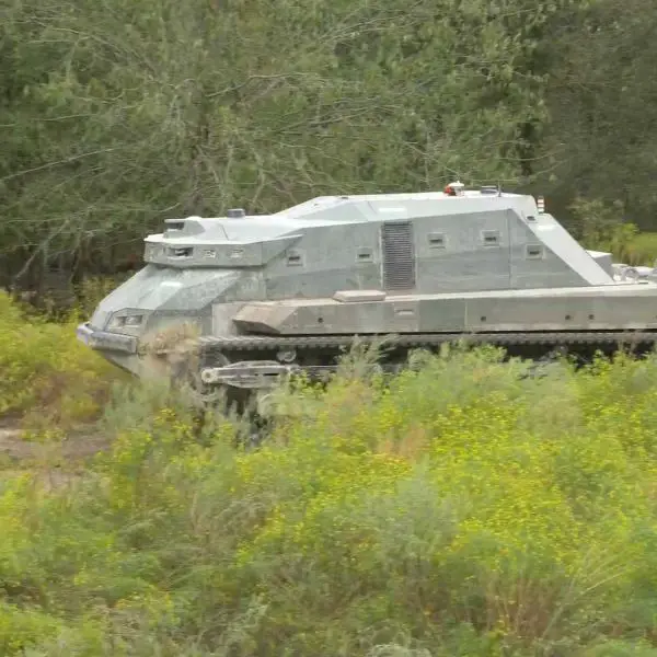 The RACER Heavy Platform is a tracked, skid-steer vehicle based on the Textron M5 vehicle and measures approximately 20 feet long with a total weight of around 12 tons. (Picture source: DARPA)