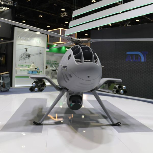 The Schiebel Camcopter S-301 displayed in armed configuration at UMEX 2026, equipped with dual Thales FZ602 launchers carrying FZ275 laser-guided rockets, marking its first public appearance in the Middle East as a fully combat-capable rotary-wing Unmanned Aerial Vehicle.
